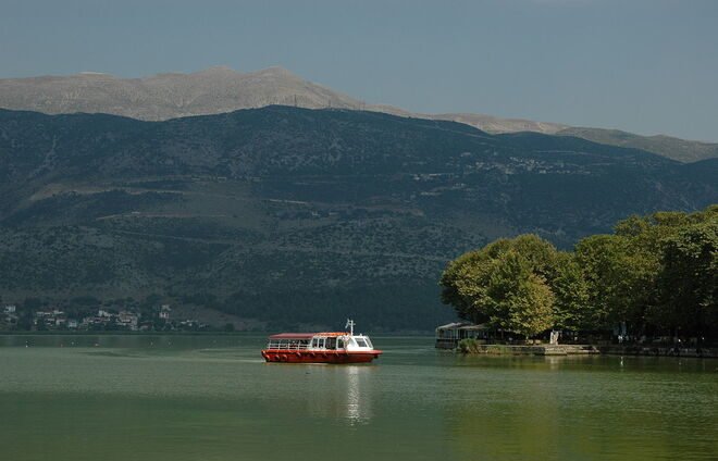Enjoy an idyllic boat ride on Pamvotis lake, in the shadows of the towering mountains that surround it.
