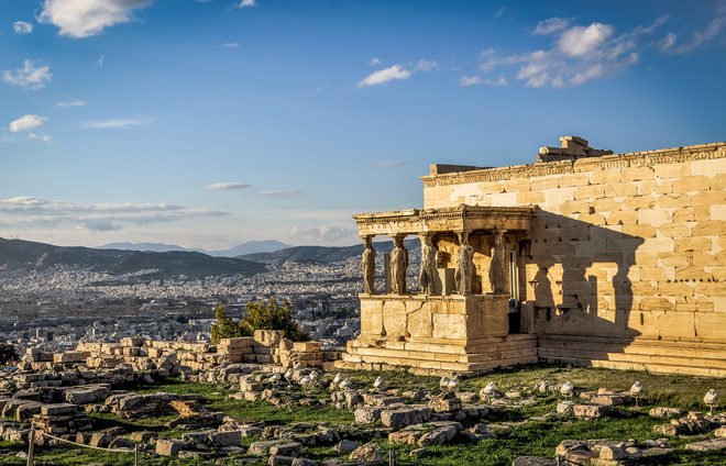 Go up to the Acropolis, an ancient citadel located above the city of Athens and the most well-known landmark of Greece.