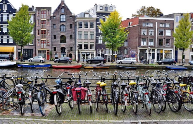 Make like a local and explore Amsterdam by bike. The city has 881,000 bikes and there is no better way to experience its beauty and learn about its often-surprising culture.