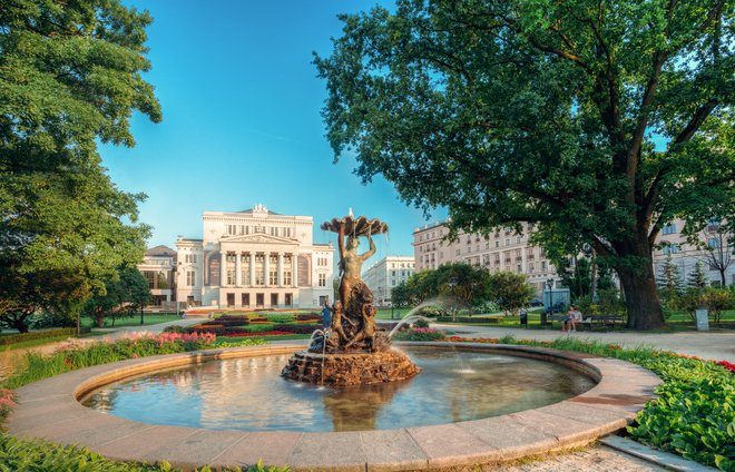 Riga, Latvia. Fountain Nymph In Water Splashes Aspazijas Boulevard Near National Opera House.