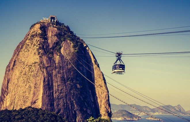 Board a cable car for a two-staged ascent up Sugar Loaf Mountain. Enjoy a breathtaking view of Corcovado, Guanabara Bay, Niteroi, the downtown area, and the beaches.