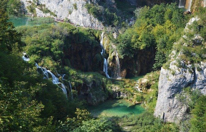Explore Plitvice Lakes National Park, the largest national park in Croatia, famous for its chain of 16 terraced lakes, joined by waterfalls, that extend into a limestone canyon.