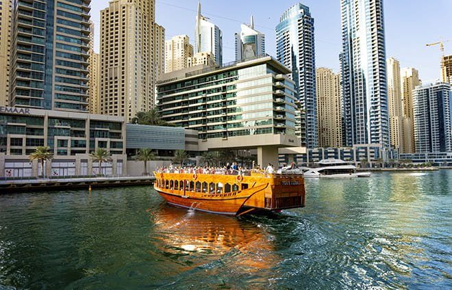 Enjoy a Dhow dinner cruise and explore Dubai's vibrant landscape.